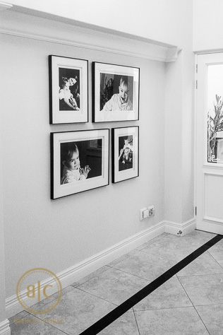 Framed Family Photo Gallery in Home Entrance